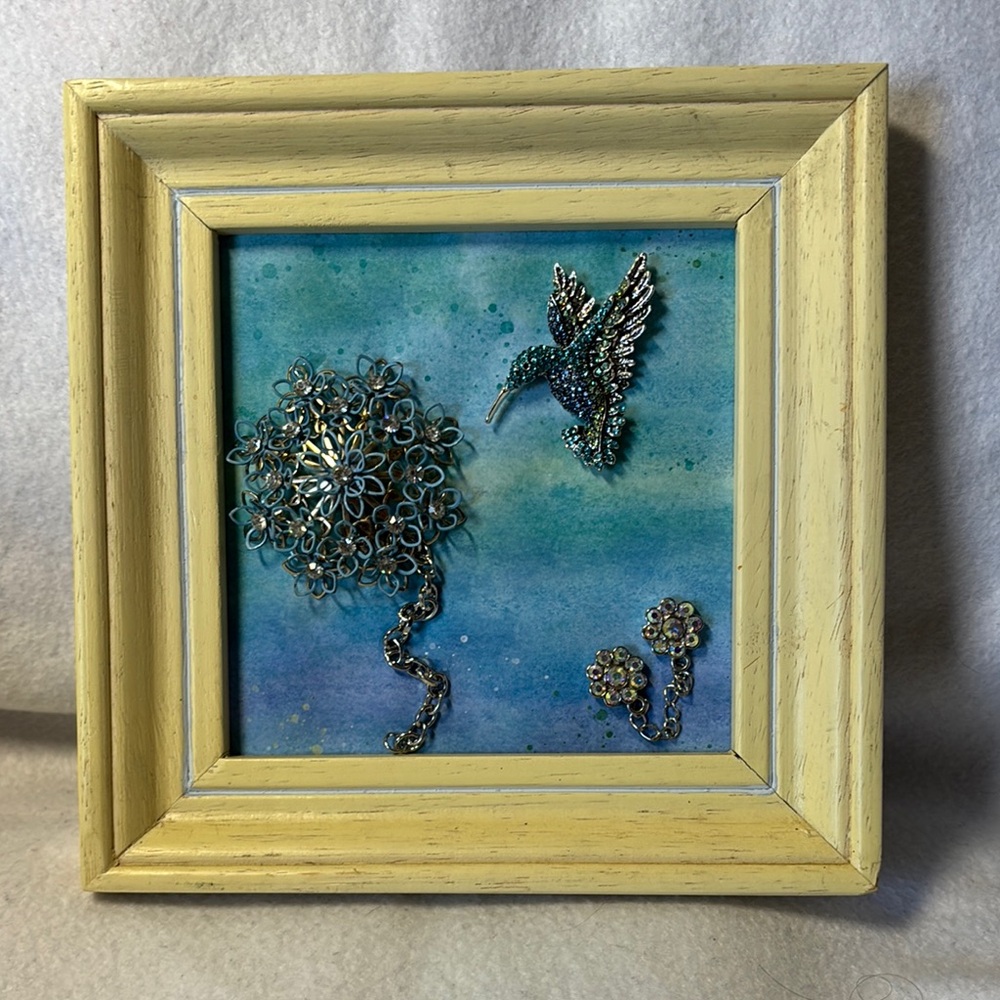 SOLD Hummingbird flies to a flower